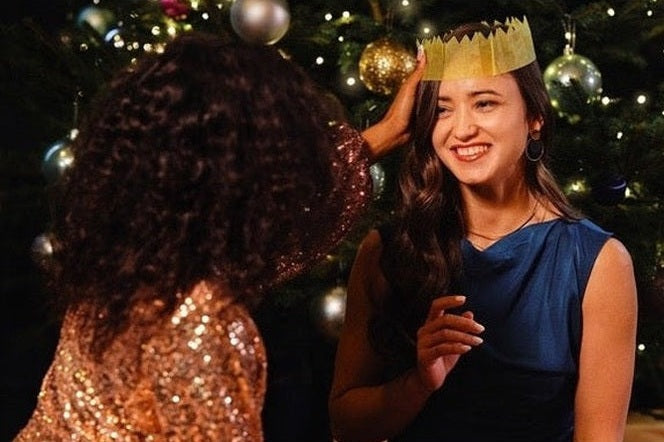 Two ladies next to Christmas Tree