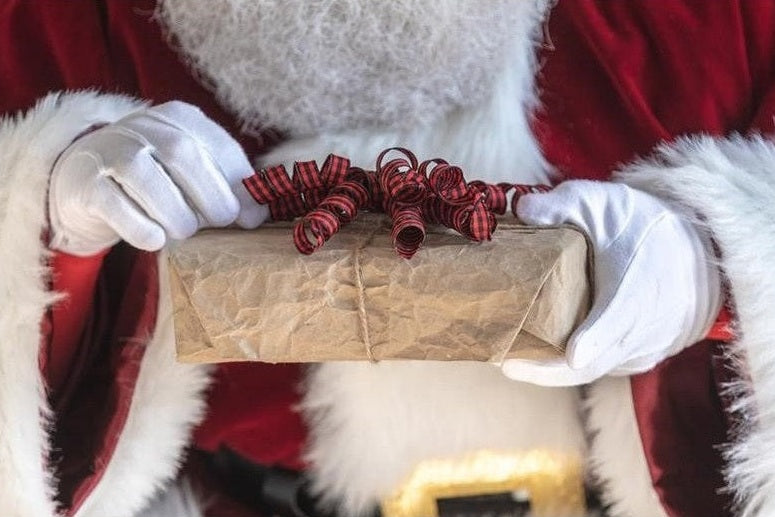 Santa holding a gift
