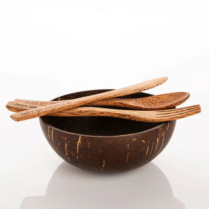 Coconut Wood Reusable Fork, Spoon and Knife on Coconut Shell Bowl.