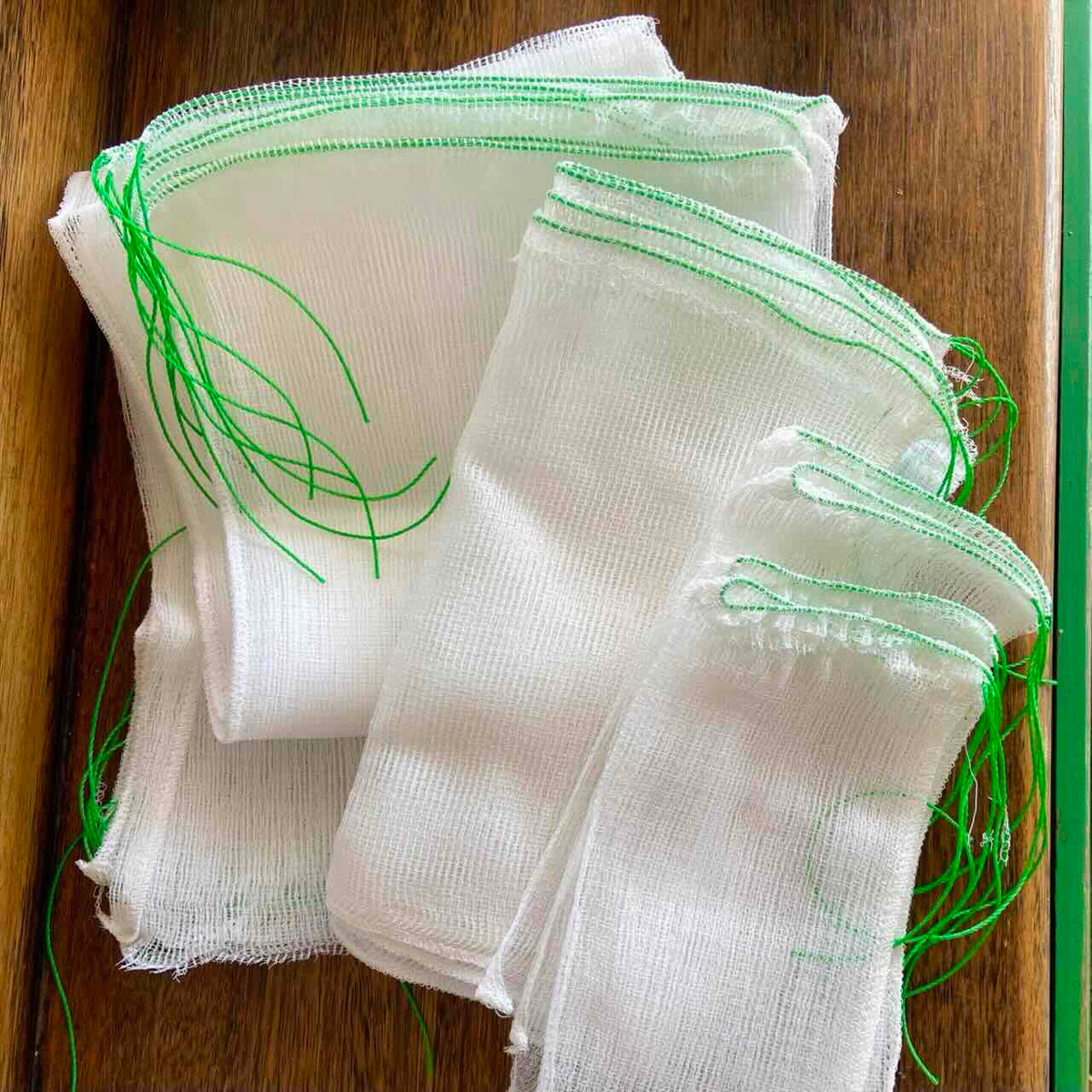 White mesh fruit protection bags and sleeves in the variety pack