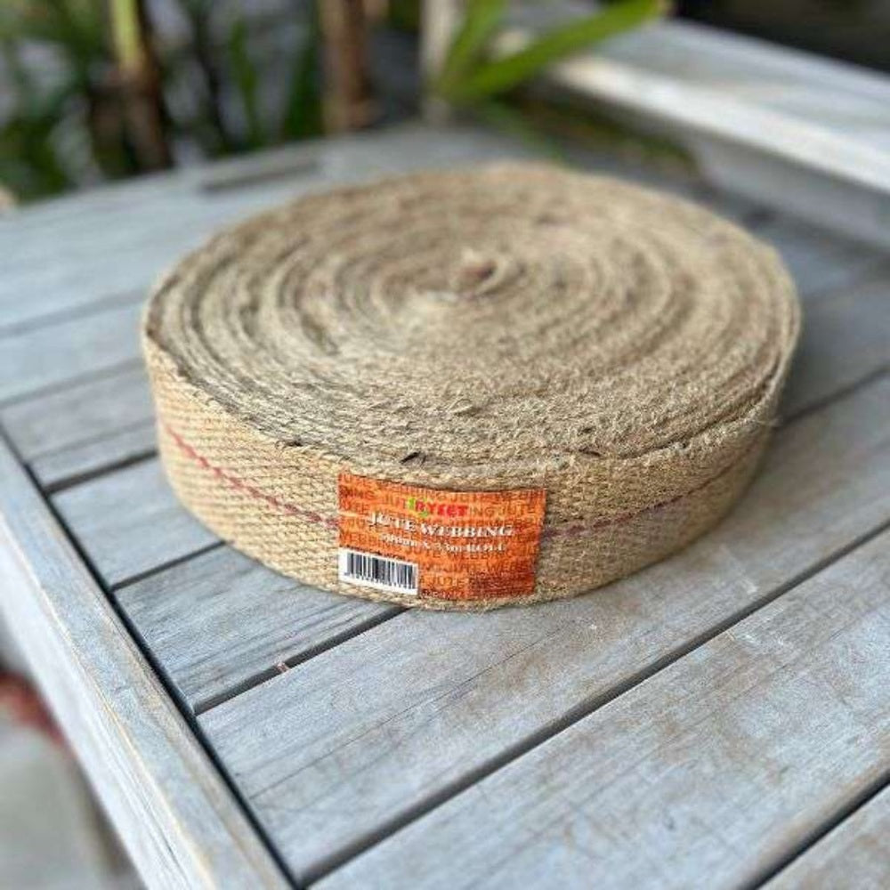 Roll of jute twine on a wooden surface with a blurred background