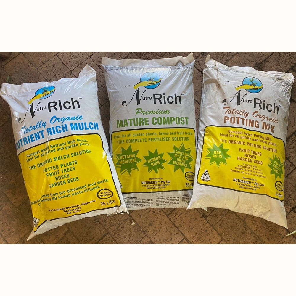 Bags of potting mix, straw mulch and mature compost