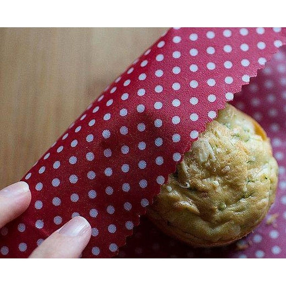 Beeswax Food Wrap Being Used to Wrap a Muffin