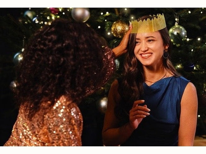 Two ladies next to Christmas Tree