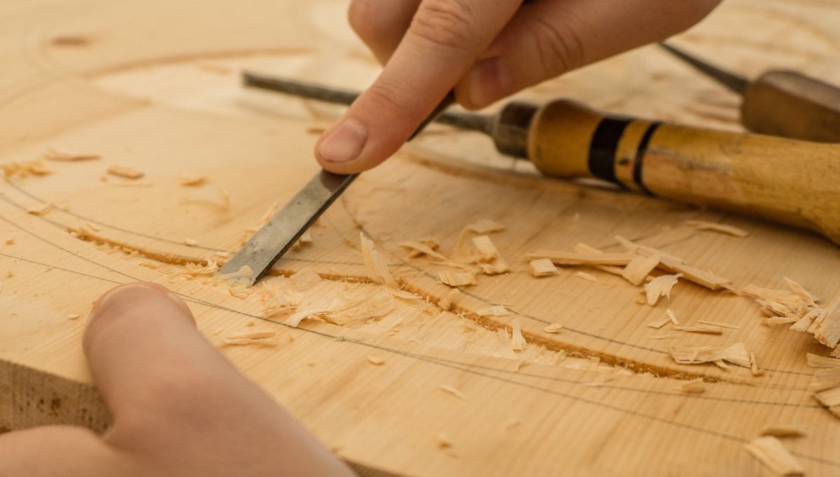 Hands demonstrating carpentry with hand tools