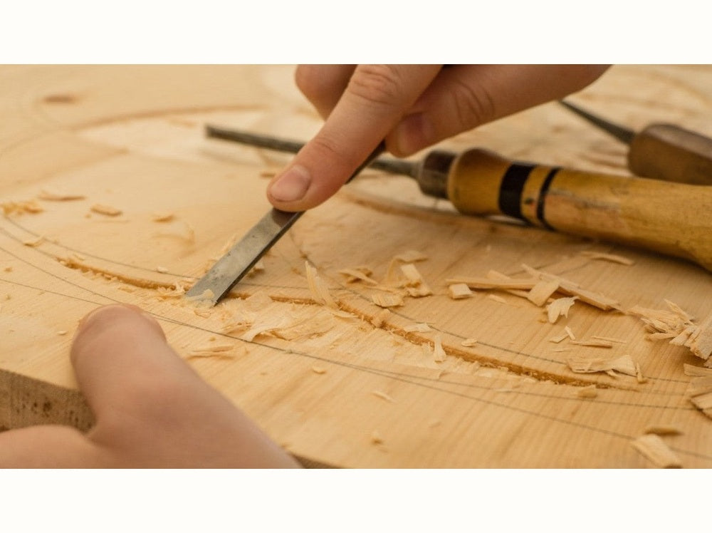 Hands demonstrating carpentry with hand tools