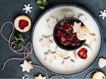 Christmas party table with decorations and themed food