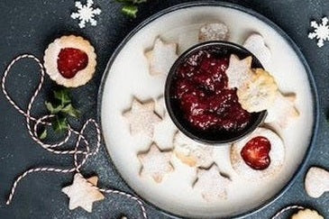 Christmas party table with decorations and themed food