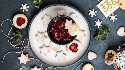 Christmas party table with decorations and themed food