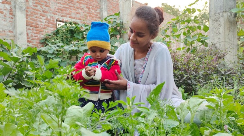 Mother and child in garden