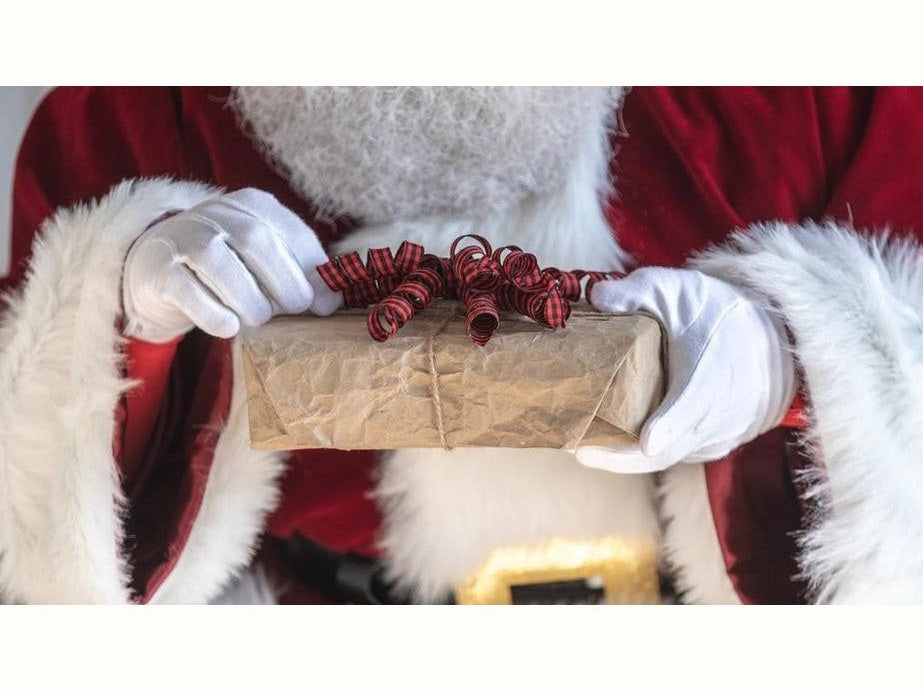 Santa holding a gift