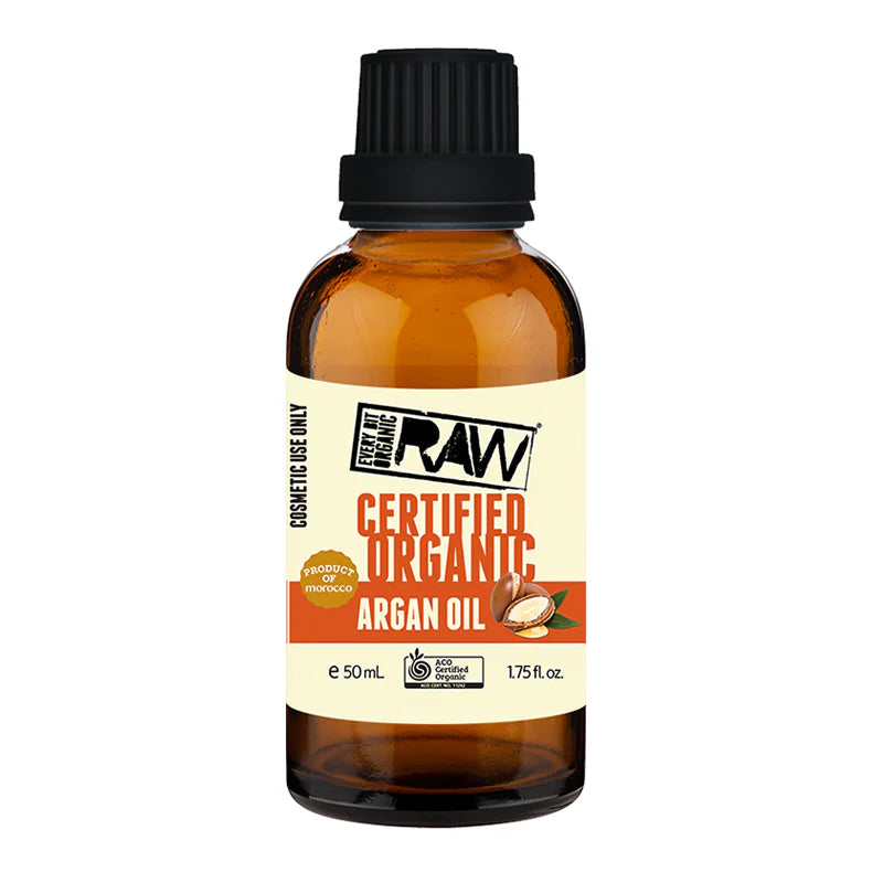 A 50 mL amber glass bottle of The Raw Organic Certified Organic Argan Oil