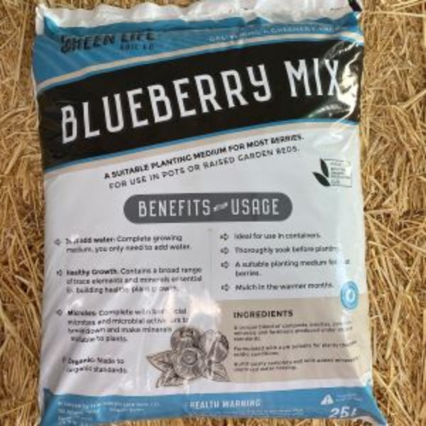 Bag of Green Life Blueberry Mix Potting Mix on a Straw Background.