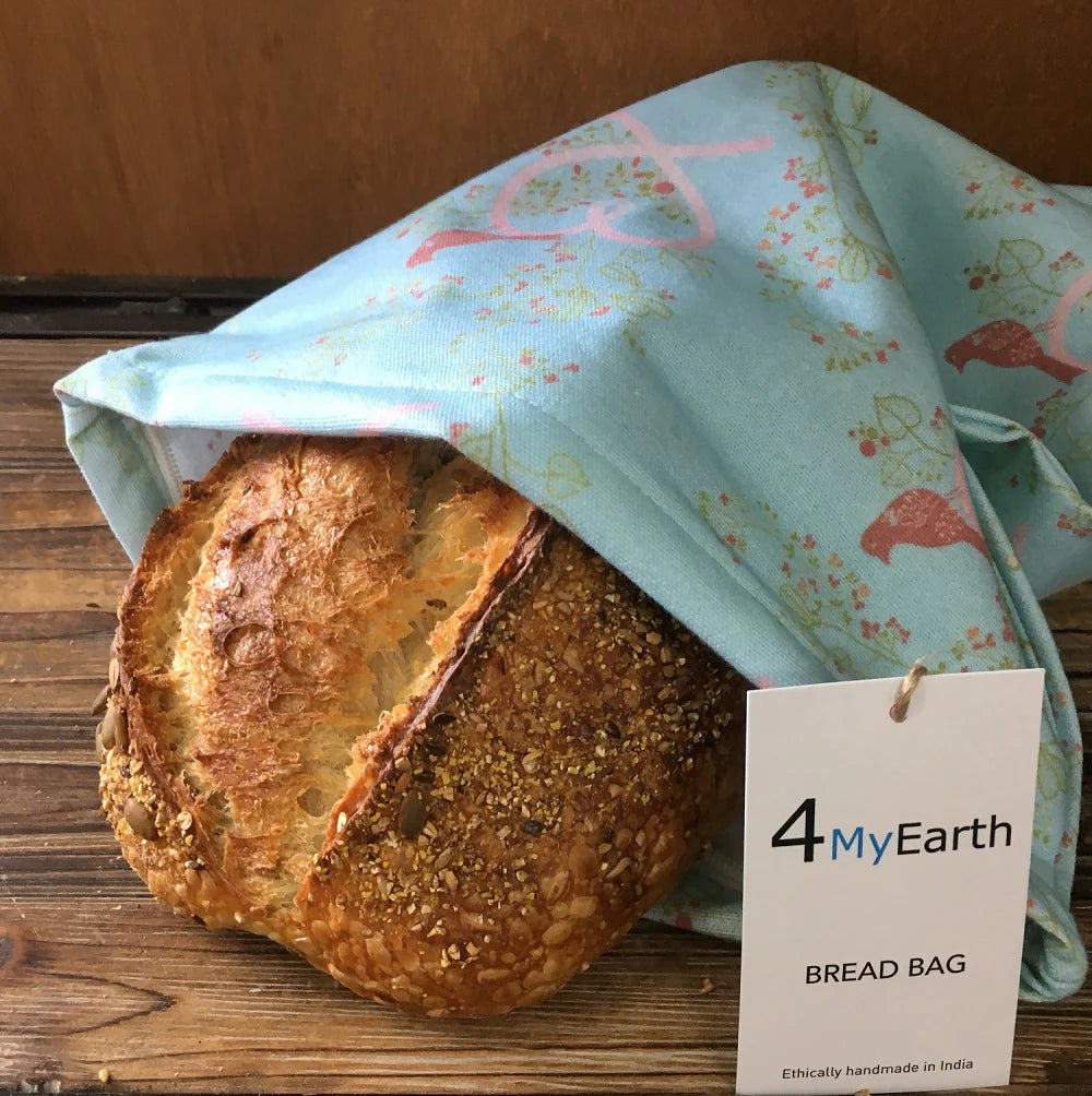 Loaf of bread wrapped in a reusable cotton canvas Love Birds print bread bag 