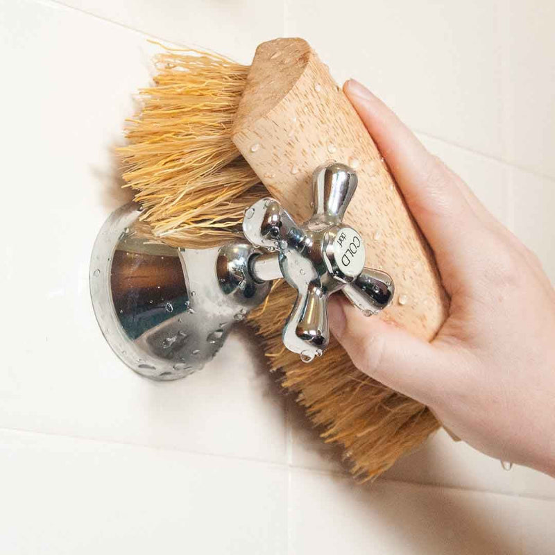 Eco Max Scrubbing Brush Being Used in Bathroom.