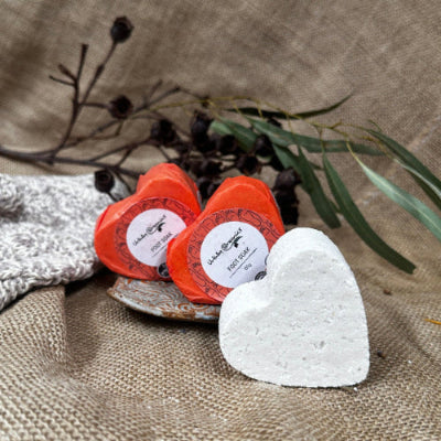 Two wrapped heart shaped Foot Soak bombs and one unwrapped