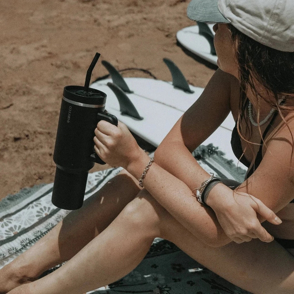 Girl Holding Ever Eco 1.18L Insulated Tumbler with Handle at Beach.