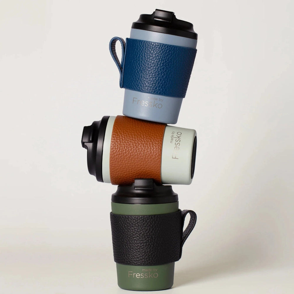 Stack of Fressko Camino Cups with Premium Italian Leather Sleeve Carriers.