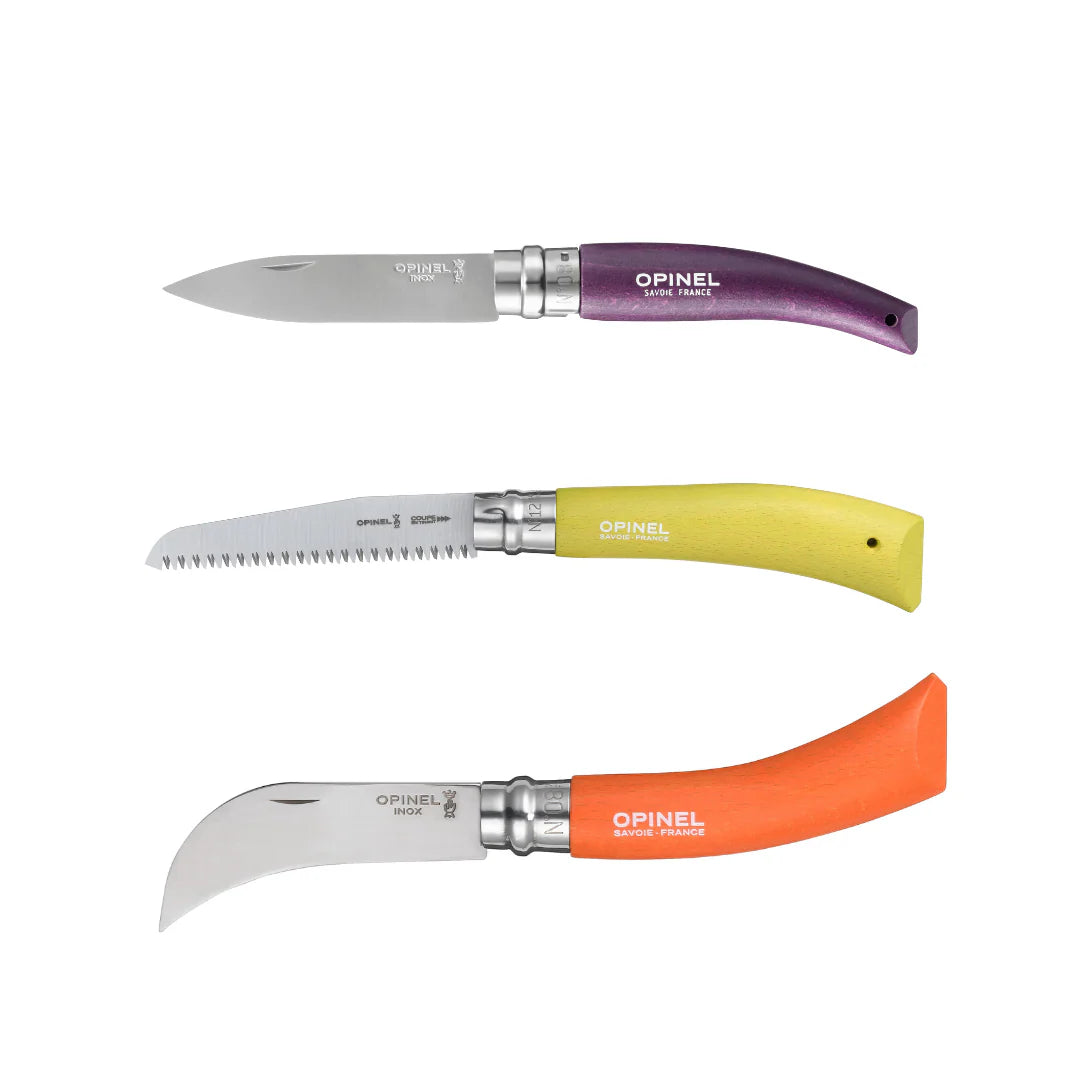Three Opinel knives with different colored handles on a white background