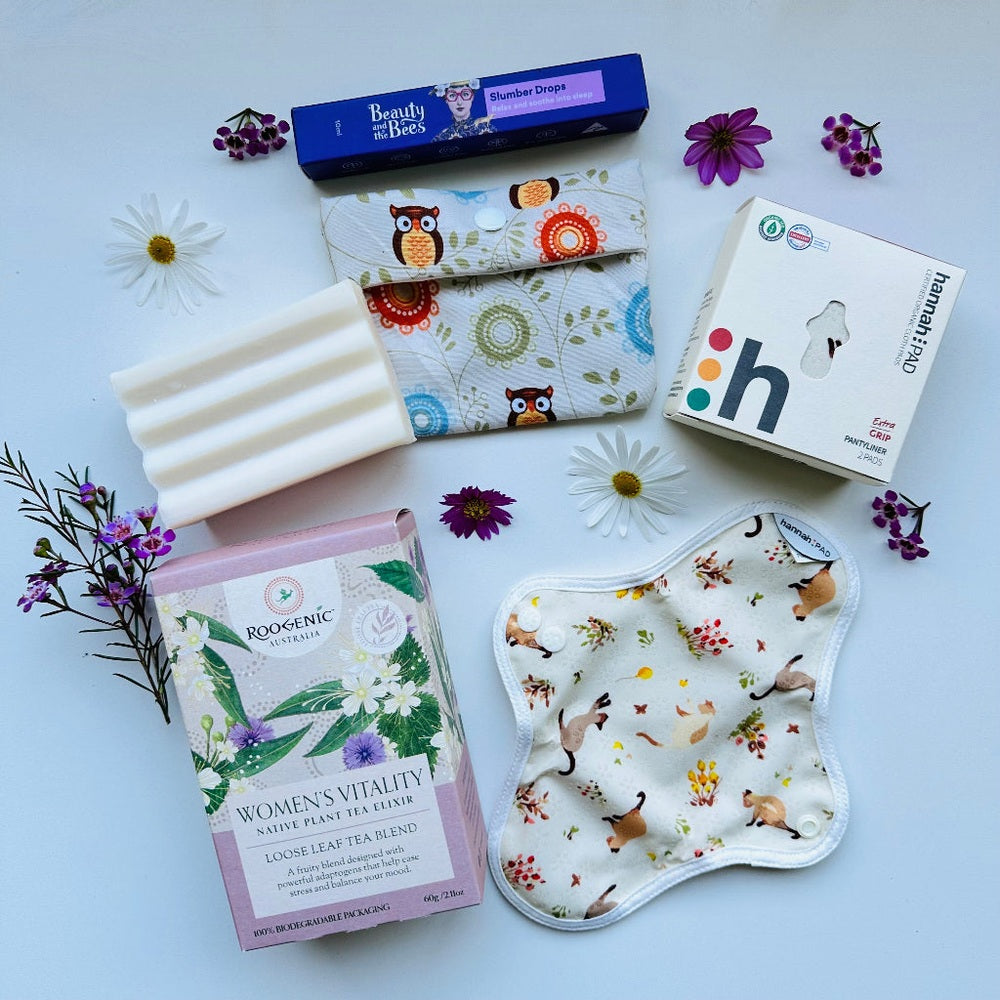 Period Care Bundle Featuring Hannah Pads, Wet Bag, Probiotics Cleaning Soap, Roogenics Loose Leaf Tea, Slumber Drops Essential Oil Roller Blend. 