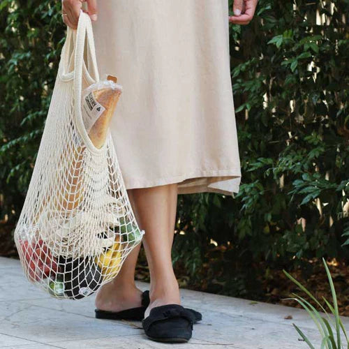 Person Carrying Eco Basics Cotton Shopping Bag with Groceries.