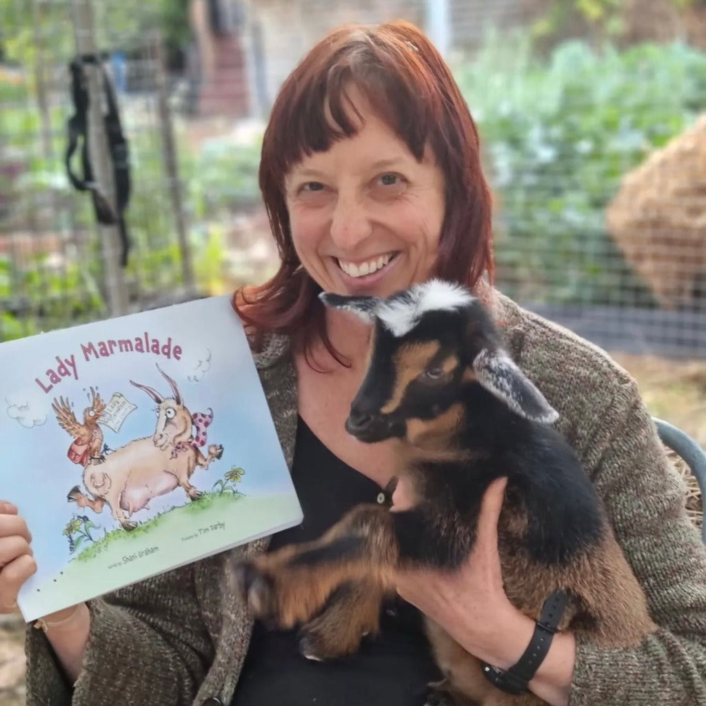 Shani Graham, Author of Lady Marmalade Holding Book and Baby Goat.