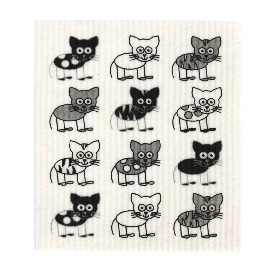 A square dish cloth with a white waffle texture featuring a repeating pattern of cartoon cats in black, gray, and white.