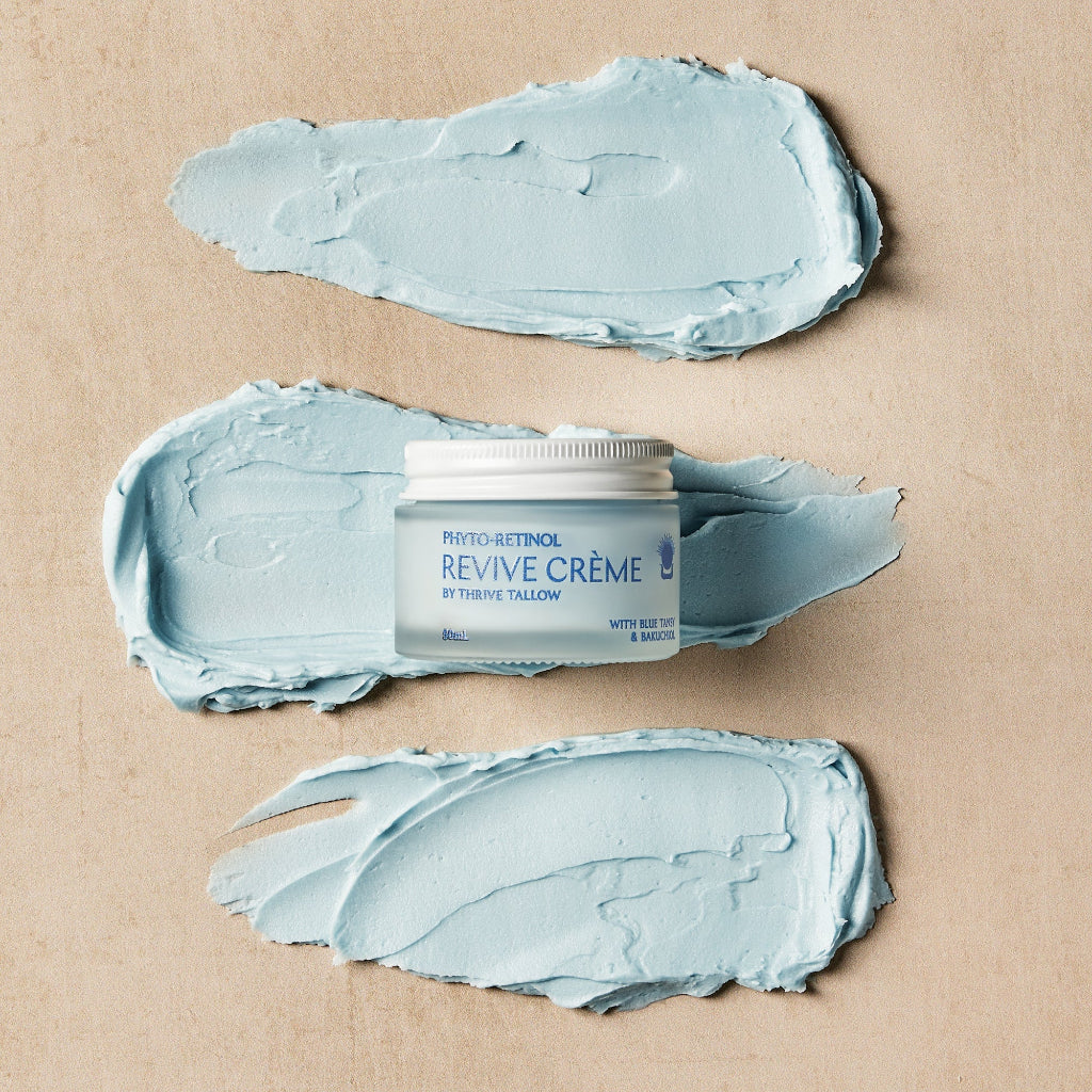 Jar of Thrive Tallow Phyto-Retinol 'Revive Crème' surrounded by smears of Retinol Creme. 