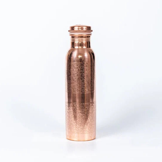 A pure copper water bottle with a hand-carved floral finish and a matching copper lid, standing upright on a clean white background.