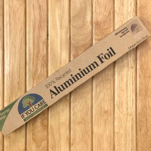 Package of Aluminium Foil on wood background