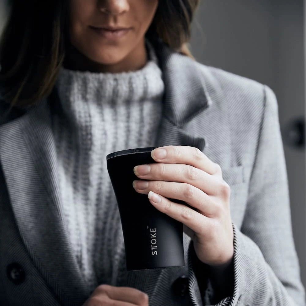 Woman holding Sttoke 8oz Cup in Luxe Black