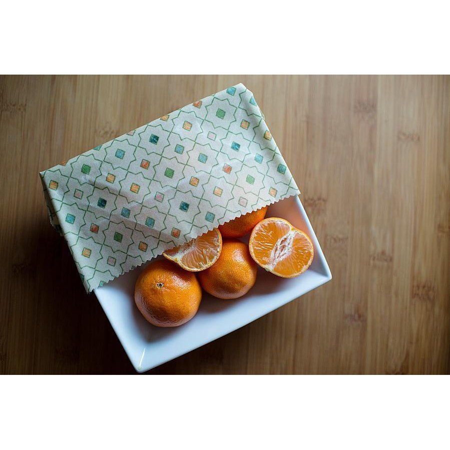 Beeswax Food Wrap Being Used to Cover Bowl of Mandarins