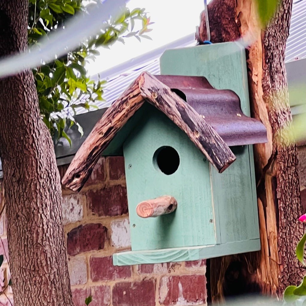 Rustic Handmade Bird House in Tree.