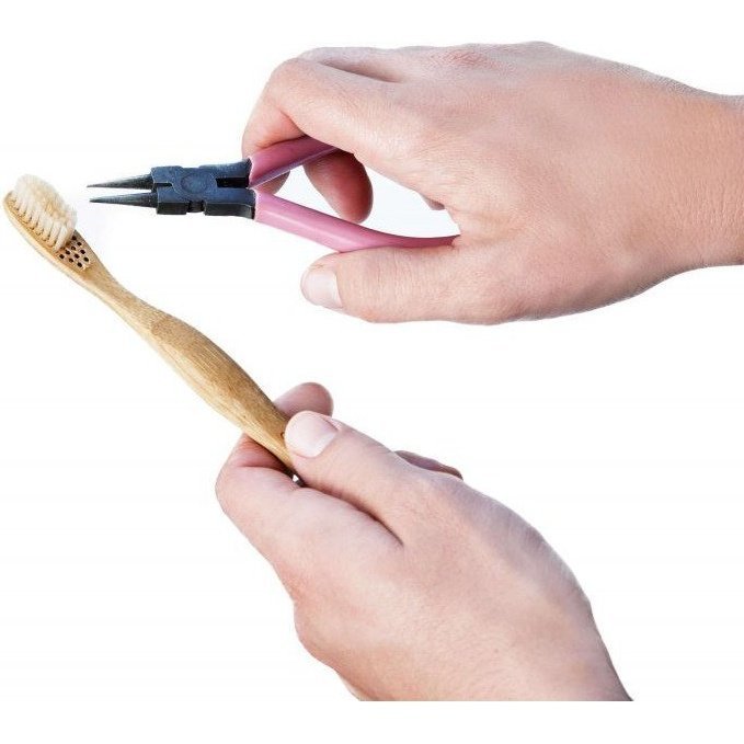 Using Pliers to Remove Bristles from a Bamboo Toothbrush