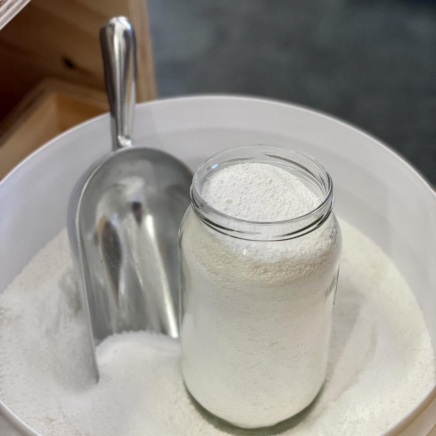 Dishwasher powder with scoop and glass jar