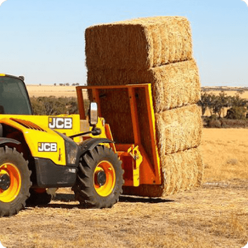 DSATCO Triple C. Mulch Bales on a Tractor on Farm, Urban Revolution.