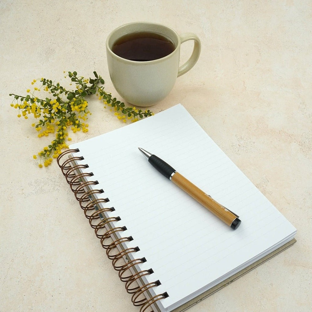 Earth Greetings Journal with Bamboo Pen and Cup of Tea.