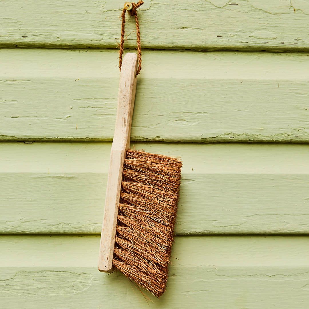 Dust Brush from Eco Max, Hanging on a Green Wall