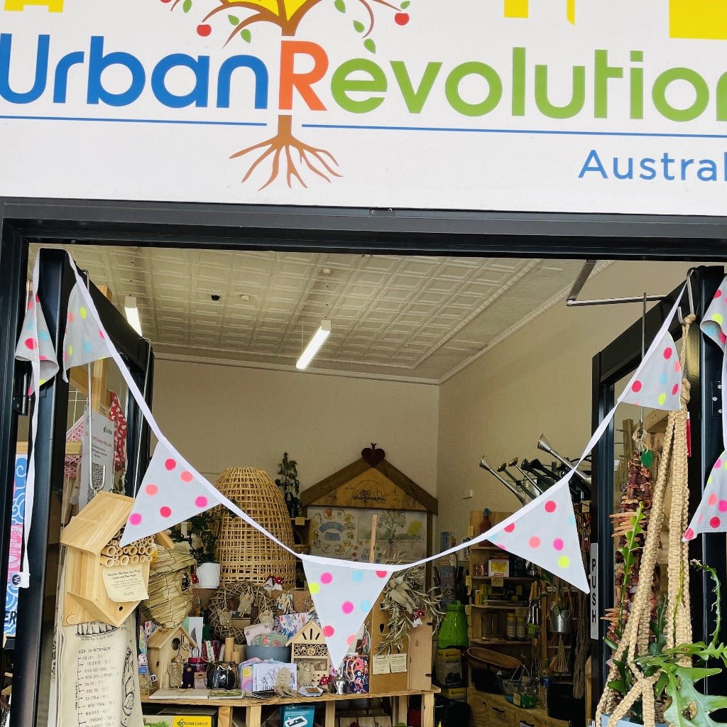 Upcycled Fabric Bunting by Paula W in front of Urban Revolution Eco Store