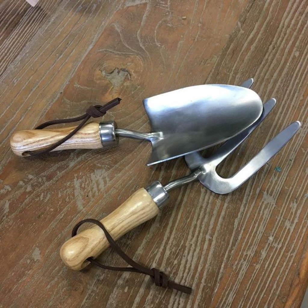 The Stainless Steel Garden Tool Set for Kids, from Heaven In Earth, on a Wooden Table