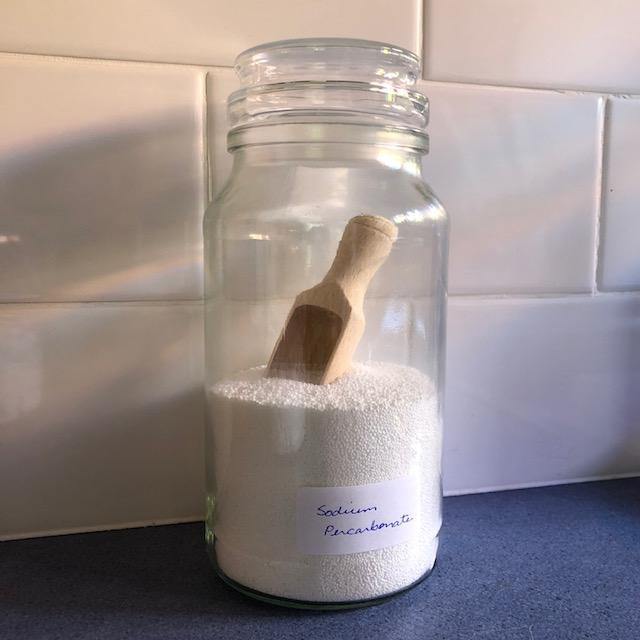 A Refillable Jar of Sodium Percarbonate with Wooden Scoop