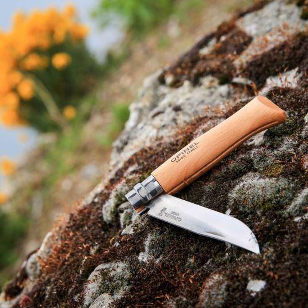 An Open Opinel No. 8 Folding Garden Knife, Lying on a Rock