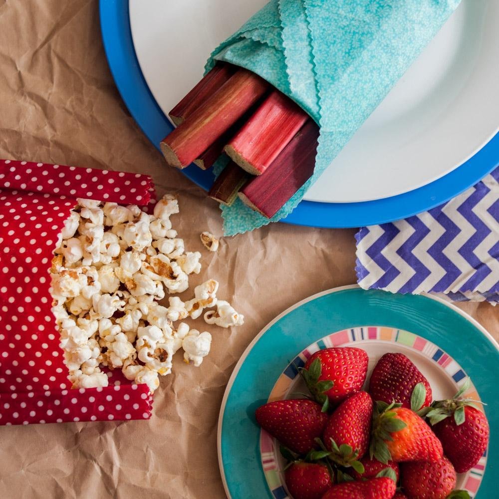 Showing Beeswax Food Wraps Being Used to Wrap Healthy Snack Food