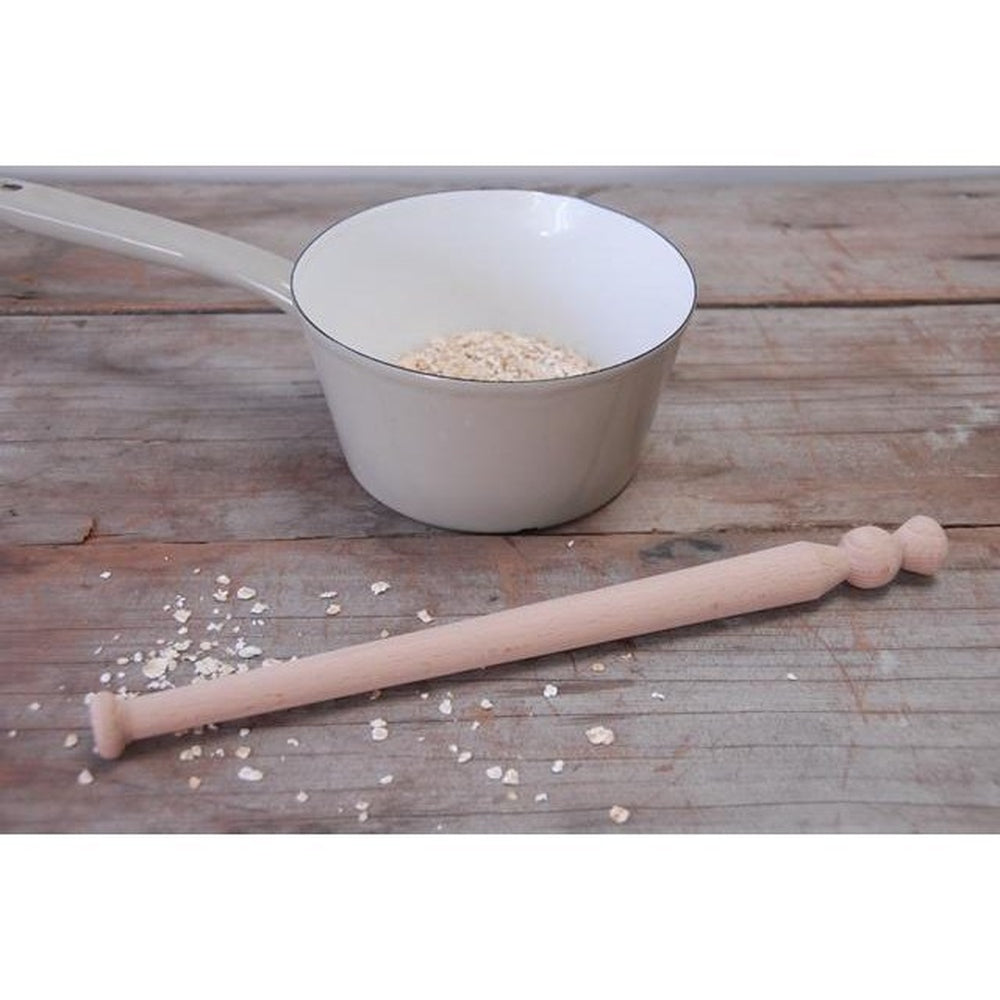 Tapered Wooden Spurtle with Saucepan of Porridge