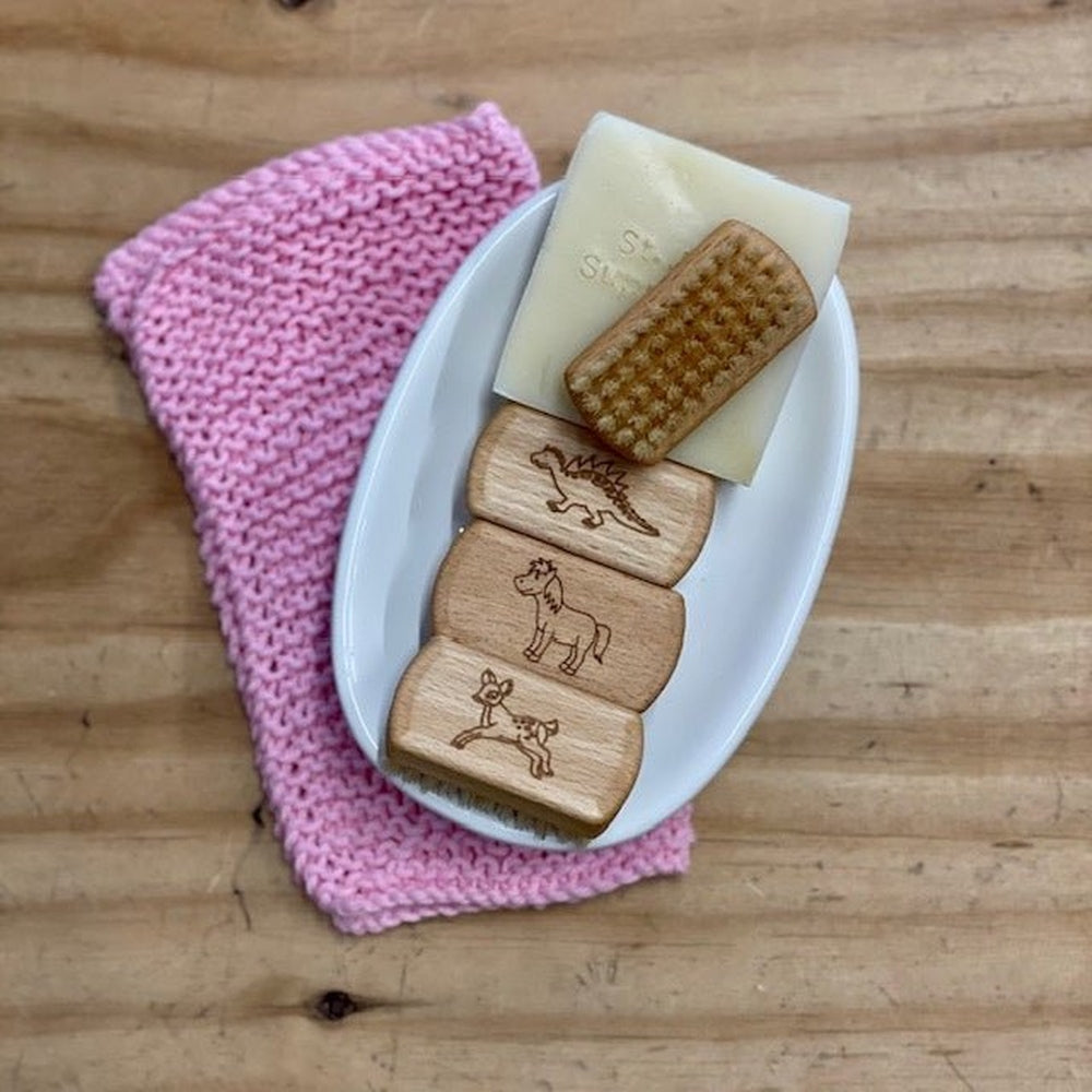 childrens nail brush in dish with soap and flannel