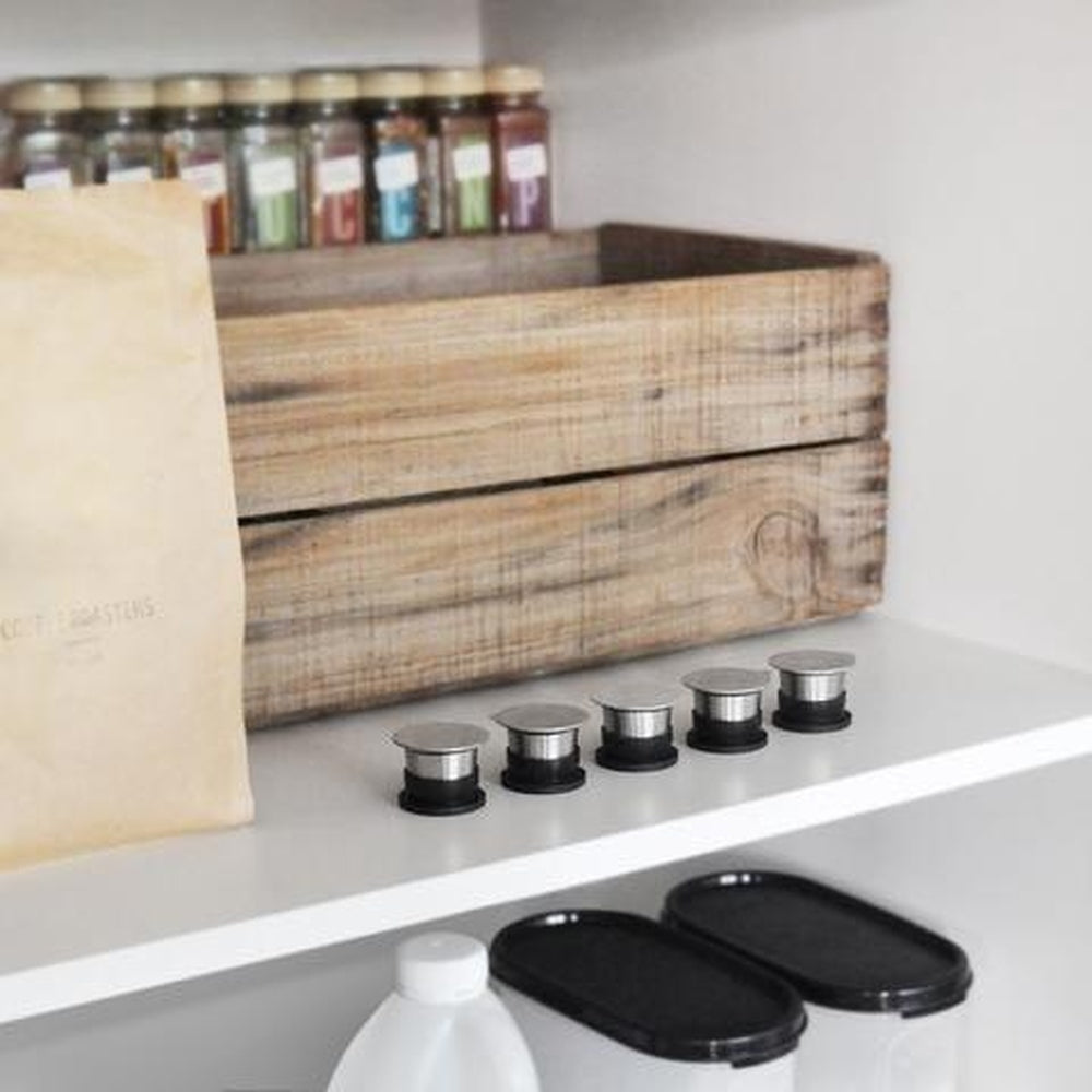 Five SealPod Reusable Coffee Capsules on a Kitchen Bench